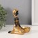 Souvenir Polystone Summary "African Rudo in a gold dress at the basin" d = 4 cm 9.5x12.5x14 cm