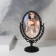 The mirror is desktop, bilateral, with an increase, a mirror surface is 11 × 15 cm, the color is black