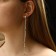 Hanging earrings with the rhinestones "celebrity" threads with beads, white color in silver, 12.5 cm
