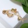 Brooch "Flowers" trio with bead, white color in gold