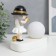 Souvenir Polystone Light "Baby in a black hat, with a gold bubble at the ball" 16.5x8x16 cm