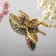 Broach "Bird" hummingbirds, the color of raspberry-green in black gold