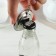 A keychain opener for keys "Distract from the hustle and bustle", diam. 5.8 cm
