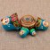 Matryoshka "God's cow", blue dress, 5 puppet, 9-10 cm