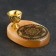 Sign of OM with a hole for incense, selenite