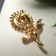 Brooch "Flower" chamomile, white color in gold