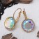 Earrings with rhinestones “Bright classic” in a frame, rainbow color in gold, d = 1.4 cm