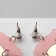 Acryl Earrings "Planet" in the hands, colored in silver