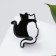 The icon "cats" hug, black and white color in ferrous metal