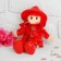 Soft toy "doll with curly hair", in a dress and hat, color mix