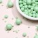Sprinking confectionery in color glaze emerald mix
