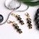 Charm "Bunny", black and white color in gold