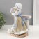 Souvenir Ceramics "Girl with flowers surrounded by rabbits" 11.5x16x23 cm