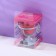 Doll Face sponge on a plastic stand for drying and storage