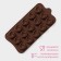 Form for sweets and chocolate of the “curl”, silicone, 21.5 × 11.5 cm, 15 cells (d = 2.8 cm), brown color