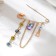 Pin-shaped “eyes” with pendants, 5 cm, color in gold