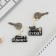 The paired key fobs “Dad Bujet/Mom Rests”, 5.2 x 7.2 cm.