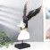 Polystone souvenir "A man in a white hat with a black bird behind him" 48x23x19 cm