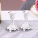 A set of 2 candlesticks, 7.5 x 7.5 x 10 cm