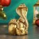 Figure "Snake of a cobra on bags with coins" 10x7x13cm, gold