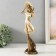 Polystone souvenir "Girl in a wide -brimmed hat. Wind" Sand with bronze 12.5x9.5x31 cm