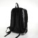 City backpack on a zipper, black color