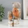 Polystone souvenir "Gray eagle owl with brown wings, with a stump of hemp" 16.8x9.5x5 cm