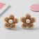 Clips children's “chosen” flower in a circle, color-brown color