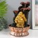 A desktop fountain with a “golden hotel from a tree with a fountain” 20.5x20x30 cm