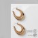 Earrings Metal are “wide” volumetric, color gold