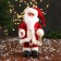 Santa Claus "with bells and with a flashlight on the staff" 30 cm, moves, red-white
