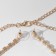 Set 2 objects: earrings, necklace “ice” Simple, white color in gold