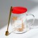 Glass mug with a spoon and a lid of the "Magic New Year", 470 ml