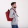 A backpack with a zipper, "saxi", outer pocket, red color