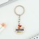 A keychain for graduation "graduate 2024", diam. 3 cm