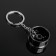 Cartage keychain, disk, metal, dark chrome