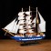 The ship souvenir medium "Spanola", the sides of white and blue, white sails, 43x39 x 9 cm