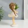 Souvenir Polystone "Baby with a scythe, with a plant in a vase" 21x9x11.3 cm