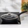 The “Tradition” pan, d = 22 cm, a plastic handle, a glass cover, a thickened bottom, anti -stick coating, black color