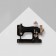 Brooch "Sewing Machine" with a hoe of threads, black and white color in gold