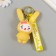 Trick rubber with carbine, strap "Bunny in the yellow overalls" 3.5x4.5x10.5 cm