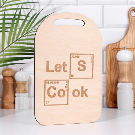 Defense and serving board with an engraving "Lets Cook" 29.25x18.75x0.55 cm, plywood