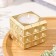 Candle "Square to a Point" in a candlestick of gypsum, 7.5x6.5 cm, gold
