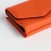 Women's wallet on the button, orange color