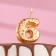 Candle in the Sanata cake, number "6", gold with red stars, 5.5 cm