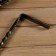 Forged poker "patina gold", bean handle, height 70 cm