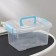 The storage container is plastic, 20 × 15 × 11 cm, a cover with a handle on a latch, matte