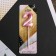 Candle for the cake, the number "2", pink.