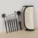 A set of makeup brushes "monogram", 7 objects, a cover on a button, golden color/black