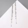 Hanging earrings with the rhinestones "celebrity" threads with beads, white color in silver, 12.5 cm